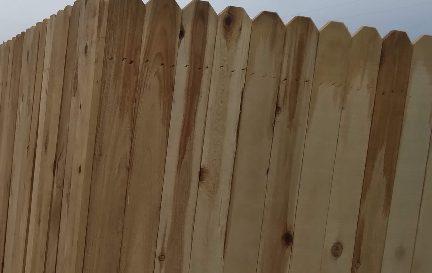 Six-foot wood privacy fence, finished face to the street