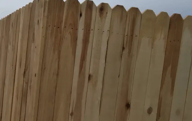 Six-foot wood privacy fence, finished face to the street